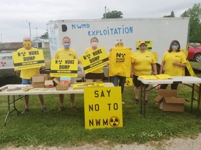 On June 8, roughly more than 100 vehicles, most with two or more people inside of them, took part in the second yellow protest parade, which travelled through Teeswater, Formosa, Mildmay and Belmore, as concerns mount for South Bruce citizens opposed to a proposed underground repository to store used nuclear fuel. Here, protesters prepare signs and T-shirts for the parade.