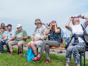 People watch the partial solar eclipse June 10 from Brorfelde Observatory in Denmark. Tom Mills wonders whether an annular solar eclipse would seem a lot more exciting if you had no idea it was coming. via Reuters