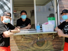 Daulton Smith, left, Spencer Stringer and Logan MacRae are three of the students who will be working the Brewside Eats truck, parked at New Ontario Brewery, for the summer. Missing is Yuzhe "Leon" Ding.
PJ Wilson/The Nugget