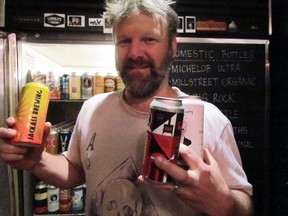 Loplops owner Stephen Alexander displays a few of the some 150 beers the Sault Ste. Marie pub’s ‘bottle shop’ is selling. JEFFREY OUGLER