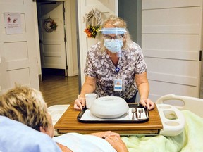 Chatham-Kent Hospice direct support and kitchen volunteer Jan Lariviere delivers a meal to a patient. The Chatham-Kent Hospice Foundation has received a $2,500 grant from Canada's Farmers Grow Communities. Contributed Photo