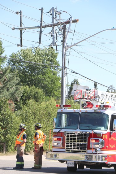 Firefighters following a collision near Boundary Road and South Market Street on Friday, June 18, 2021. (BRIAN KELLY/THE SAULT STAR/POSTMEDIA NETWORK)