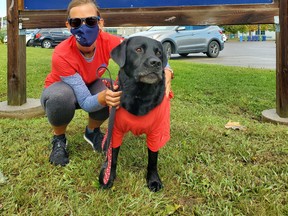The MFRC's Tanya Brown and facility dog Hercules are ready for the agency's On the Move fundraiser and awareness campaign.