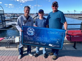 Mayor Craig Copeland presents the $10,000 first place prize to the Protz family, from Lloydminster, who won the city's fishing tournament held on June 19 and 20. PHOTO: CITY OF COLD LAKE/FACEBOOK