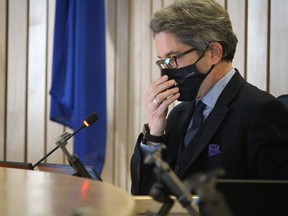 Mayor Rod Frank adjusts his mask in council chamber. On July 1, Strathcona County intends to follow the province's lead to no longer require masking in certain indoor settings, as outlined in Alberta's Stage 3 reopening plan. Lindsay Morey/News Staff