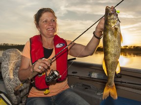 Francine Dubreuil  shows off a fine catch. Great fishing means we can be entertained fishing all day or just pop out when the spirit moves us. James Smedley