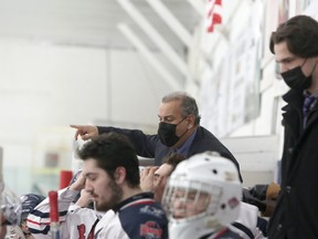 French River Rapids head coach Paul Frustaglio speaks to his players during first-period NOJHL action against the Espanola Express at Noelville Community Centre on Tuesday, February 23, 2021.
