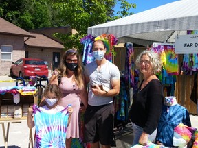 Port Elgin's Lilla Freeburn, 7, picked out a tie dye outfit as an early birthday present as she shopped with parents Desiree and Dean at the Far Out Farm booth June 23 at the Port Elgin Farmers Market.