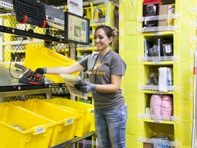 An Amazon fulfillment Centre worker goes through her inventory. The tech giant recently announced it would be opening its first Alberta robotics fulfillment centre in the Edmonton area.
