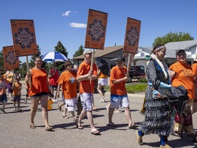 Wendy Goulet lead the smudging for the Orange Shirt Day walk that took place in Fairview, Alta. on June 26, 2021. The walk was held to honour residential school survivors, and those that did not survive residential schools.