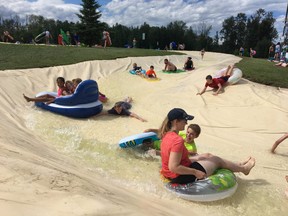 Crowds gathered for Whitecourt's River Slides in July 2019. The slides have been closed for the past two years.