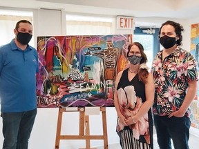 Meeting artists Susan Seitz and Brent Henry (right) at the Shadows exhibit at Southampton Arts Centre convinced Saugeen Shores Mayor Luke Charbonneau (left) to commission Henry to create a painting for the Town as a reminder of the loss of life inflicted by the Residential School system on Canada’s Indigenous people.