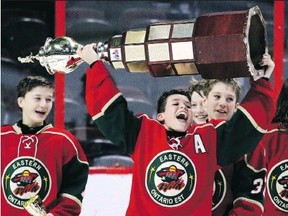 In his younger days, Soo Greyhounds prospect Ethan Montroy of the Eastern Ontario Wild hoists the championship trophy after his team won the pee wee AAA final at the 20th Bell Canada Cup, played in 2018 at the Canadian Tire Centre in Ottawa.