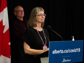 Dr. Deena Hinshaw (right), Alberta chief medical officer of health, gives her final regularily scheduled COVID-19 update next to ASL interpreter Randy Dziwenka during a press conference at the Federal Building in Edmonton, on Tuesday, June 29, 2021. Photo by Ian Kucerak
