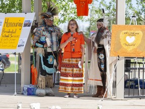 L-R: Alden Cree, Frida Jensen Kuefler and Bernadette Dumais of Fort McMurray First Nation #468 at a memorial in Anzac, Alta. for survivors and victims of the residential school system and Sixties Scoop on Sunday, June 13, 2021. Robert Murray/Special to Postmedia/Fort McMurray Today