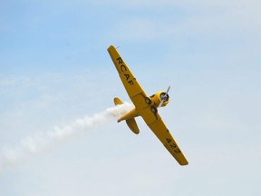 A Harvard Mk. IV flies past Bob Kays home at Mallory Beach on Saturday, June 5, 2021.