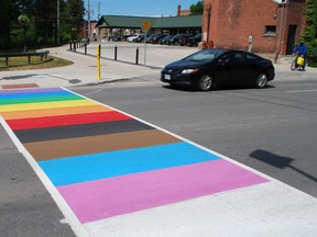 Owen Sound's new rainbow crosswalk, which is to be officially unveiled Thursday morning, includes the colours of the LGBTQ+ Pride flag, along with the white, light blue and light pink of the transgender Pride flag and black and brown to represent marginalized communities. DENIS LANGLOIS