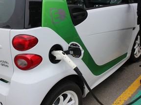 An electric vehicle charging in Woodstock, Ont. Canada will ban the sale of fuel-burning new cars and light-duty trucks from 2035 in an effort to reach net-zero emissions across the country by 2050,