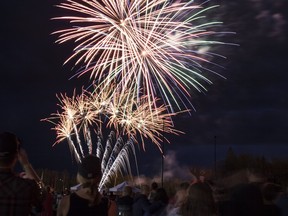 Fireworks explode in the sky to mark the end of Canada Day as McMurrayites watch from below at MacDonald Island in Fort McMurray Alta. on Sunday July 2, 2017. Robert Murray/Fort McMurray Today/Postmedia Network