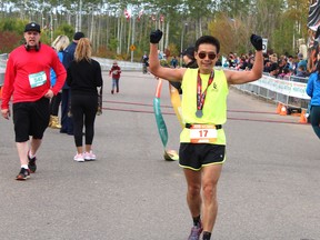 Yusheng Ni, the winner of the men's heat of the Fort McMurray Marathon, just after crossing the finish line on Sunday, September 15, 2019. Vincent McDermott/Fort McMurray Today/Postmedia Network