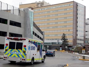 An ambulance is seen driving into the emergency entrance of the Foothills Medical Centre. Wednesday, December 9, 2020. Two patients who tested positive for the COVID-19 Delta variant at the Foothills facility have died, in what are believed to be the first such deaths in Alberta.