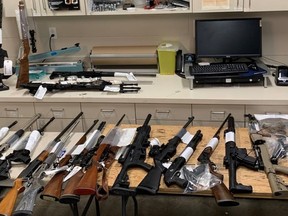 Firearms and other items seized following an arrest and the execution of a search warrant. PHOTO SUPPLIED GRANDE PRAIRIE RCMP