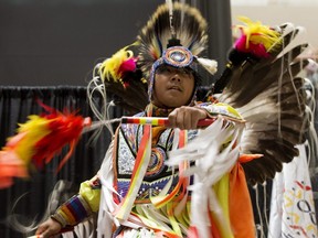 Members of the Heavenly Skies Society perform during Indigenous Peoples Day celebrations at Edmonton City Centre, June 20, 2019.