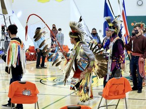 Memorial Composite High School (MCHS) students and members of Paul First Nation conduct the grand entry of the flags during Parkland School Division's "Cultural Graduation Celebration" on Tuesday, Jun. 15, 2021. Photo by Rudy Howell/Postmedia.