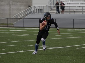 Liam Bartlett runs up the field in possession of the football. Supplied image/ Kevin Garbuio