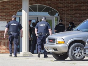 Police enter the Church of God in Aylmer on Friday May 14, 2021. (Derek Ruttan/The London Free Press)