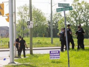 London police officers on Monday morning continued to investigate near the scene of a Sunday evening crash that killed four pedestrians and left another one, a child, in hospital with serious injuries. A male driver, 20, has been arrested. Photo taken Monday June 7, 2021. (Mike Hensen/The London Free Press)