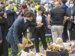 Prime Minister Justin Trudeau lays flowers at the London Muslim Mosque during a Tuesday night vigil in memory of the four members of a local Muslim family killed two days prior in what police are calling a hate-motivated attack. (Mike Hensen/The London Free Press)