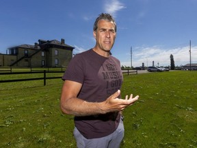 Jones Entertainment Group president Brad Jones stands where a summer stage will be set up outside Crossings Pub and Eatery on Hyde Park Road for the Road to Rock the Park Patio Series. (MIKE HENSEN, The London Free Press)