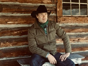 Singer Corb Lund at the cabin at the Rocking P ranch property in the Livingstone River valley right below Cabin Ridge, site of a proposed coal mine north of Coleman, Ab. The ridge was named for this cabin.