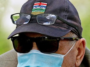 A man wears a face mask in Edmonton during the COVID-19 pandemic. Whitecourt is following Edmonton in scrapping its mandatory mask bylaw.