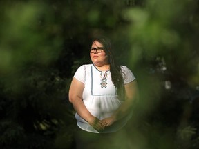 Melissa Mbarki, policy analyst of the Macdonald-Laurier Institute, poses for a photo outside her home, in Edmonton ThursdayJune 3, 2021.