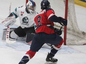 Stratford’s Carter Schoonderwoerd fires a shot past Brantford goalie Jukka Schotter during the GOJHL game in December 2019 at Allman Arena.