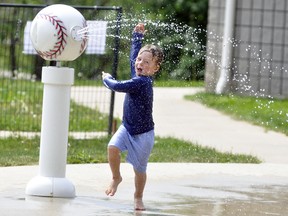 Mason Feltz, 3, of Mitchell, was jumping for joy at the West Perth splash pad May 25 as a way to beat the heat. He and mom Chelsea were at the park when they discovered the pad was open for use. The municipality opened the splash pad May 22, from 10 a.m. to 6 p.m., but there are a limit of 10 people allowed at any one time for social distancing requirements. Residents are asked to self-police this rule and be patient if it is busy. ANDY BADER/MITCHELL ADVOCATE