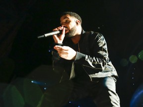 Drake gets up close with the crowd at his OVOFest held at the Budweiser stage in Toronto on Aug. 7, 2017.