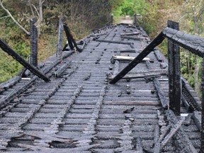 The burned trestle bridge on the Bruce County rail trail over Willow Creek near Paisley.