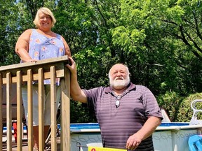 Heather Showler and Bill Swanton are among dozens of residents in a neighbourhood on the west side of Simcoe who are discouraged by the prospect of losing a large, mature woodlot near their homes. – Monte Sonnenberg