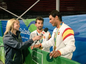 Canmore's Kelly VanderBeek interviews Rafael Nadal and Mark Lopez after they win gold at the Rio Games in 2016. Photo submitted.