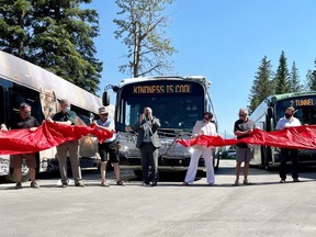 Elected officials, Martin Bean CAO OF Roam Transit, Ric McIver Minister of Transportation and Municipal Affairs, Karen Sorensen Mayor of Banff, Brian Standish Chair of Bow Valley Regional Transit Services Commission, at the unveiling of the first electric transit buses in Banff National Park. The event also cut the ribbon opening the Town of Banff's Roam Transit Operations Centre and solar system, a green building project designed to advance on its road towards a zero emissions service for the Bow Valley communities of Banff, Canmore, and Lake Louise and through the national park. Photo Marie Conboy/ Postmedia.