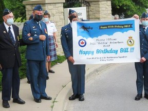 Members of 8 Air Maintenance Squadron and 418 Wing RCAFA members join Bill Robertson in a small socially-distanced visit to celebrate his 100th birthday in Trenton Belleville, Ontario on June 11, 2021. Squadron members respected public health measures throughout the celebration. SUBMITTED PHOTO