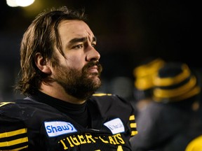 Brantford's Mike Filer has re-signed with the CFL's Hamilton Tiger-Cats.