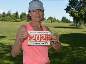 Kathy Easter proudly displays the commemorative bib she received after registering for this year's Canada Day Run/Walk presented by the Brockville Road Runners Club. Bib supplies are limited; the registration fee for the July 1 event is a donation to the Brockville and Area Food Bank.
Tim Ruhnke/The Recorder and Times