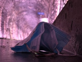 A discarded face mask lies in the Brockville Railway Tunnel on Friday afternoon. Masks are still mandatory inside the tunnel, which opened on Friday. (RONALD ZAJAC/The Recorder and Times)