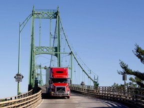 A transport truck crosses over the Thousand Islands Bridge from the United States, back into Ontario on Wednesday, June 23.