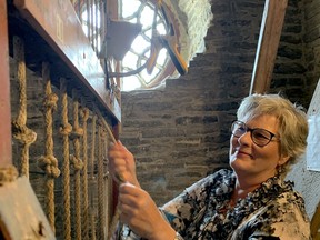 Deanna Powers rings the Ellacombe Chimes at St. Lawrence Anglican Church on Friday afternoon. (RONALD ZAJAC/The Recorder and Times)