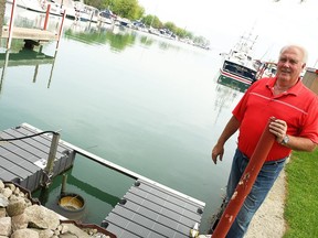 Dave Barnier, owner of Erieau Marina, is shown next to a Seabin, which captures surface-level plastic, on June 3, 2021. The marina is participating in the Great Lakes Plastic Cleanup project.